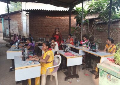 Women sewing undercover outside